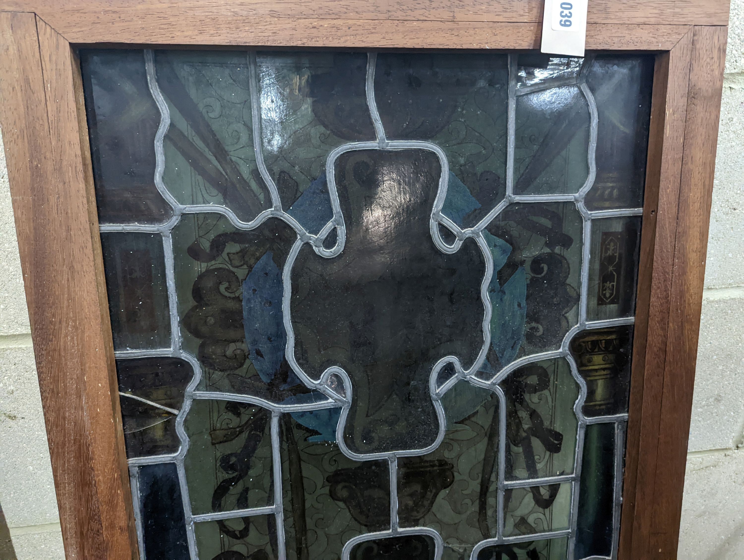 A rectangular stained glass panel, width 56cm, height 99cm including frame